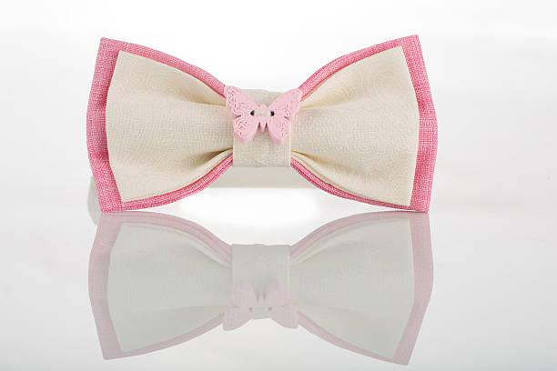 istock white bow tie with pink accents and a butterfly 496199174