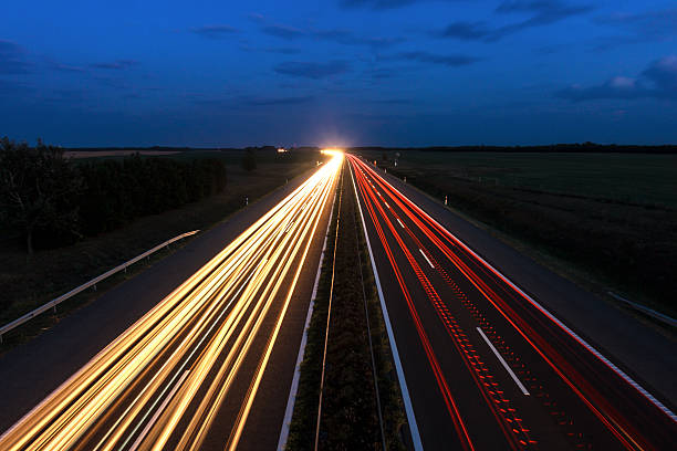 istock Cars speeding on a highway 496199235