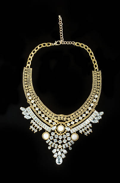 istock metal feminine necklace. on black  background 496200662