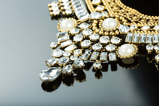 istock metal feminine necklace. on black  background 496200696
