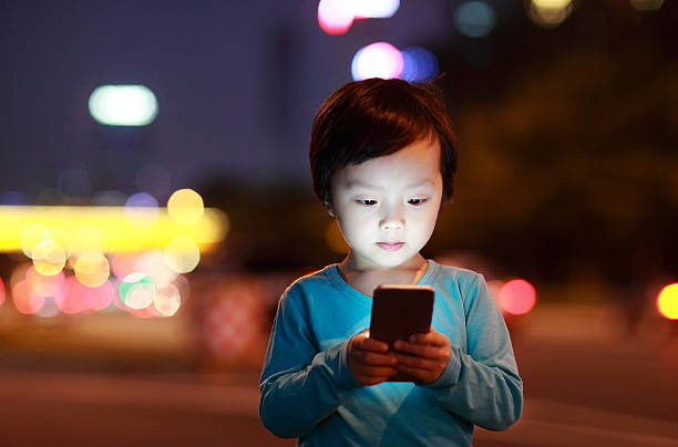Boy Using Smart Phone stock photo