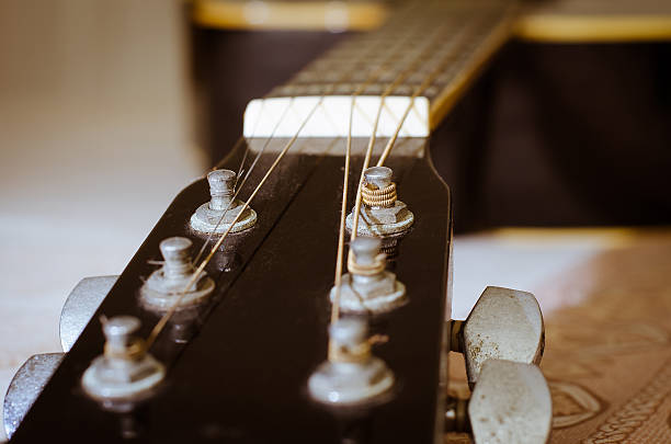 istock Tuning Keys of Dusty Old Guitar (clos up). 496207522