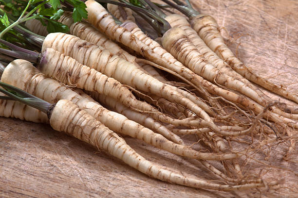 istock parsley roots on wooden cutting board 496208436