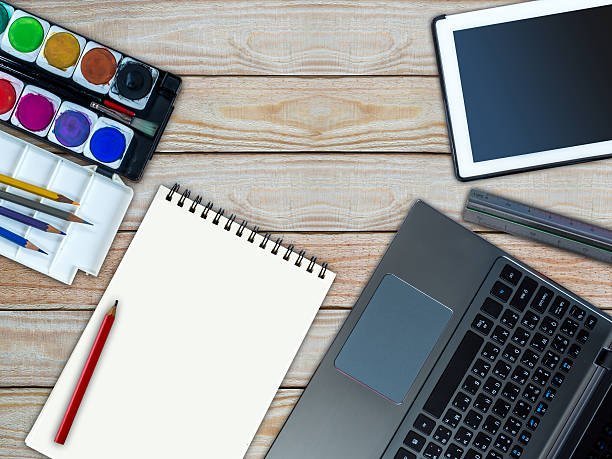 istock Laptop, tablet, sketch book, water color/ creative office equipment concept 496227858
