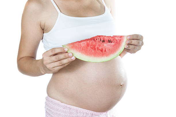 istock Pregnant with watermelon. 496228368