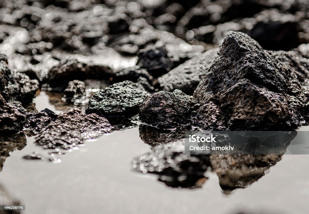 Rocky coast of Tenerife Rocky coast of Tenerife. Black volcanic stones. Canary Islands. Spain 2015 Stock Photo