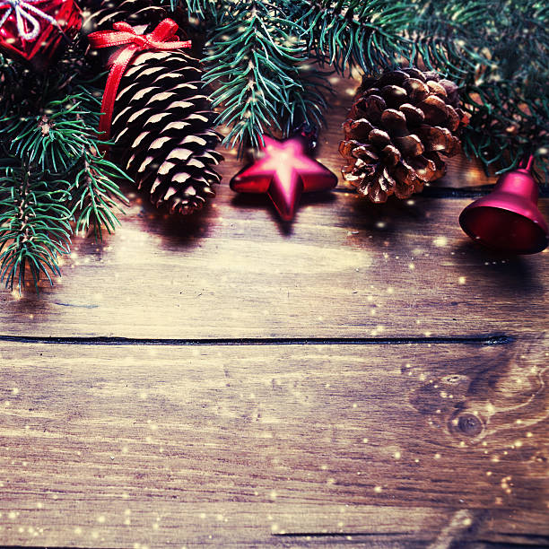 istock Christmas fir tree with decoration on dark wooden board 496229614