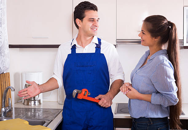 istock Housewife called professional plumber with tools to change  bibc 496230774