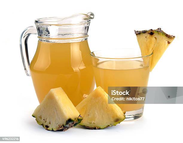 Full Glass And Jug Of Pineapple Juice Stock Photo - Download Image Now - 2015, Carafe, Cross Section