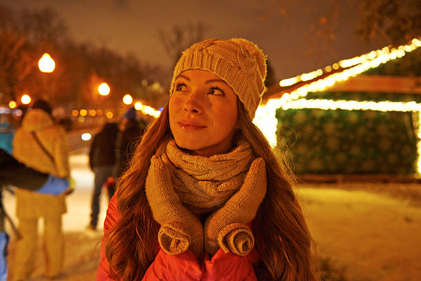 istock Young woman enjoying winter on ice rink 496232594