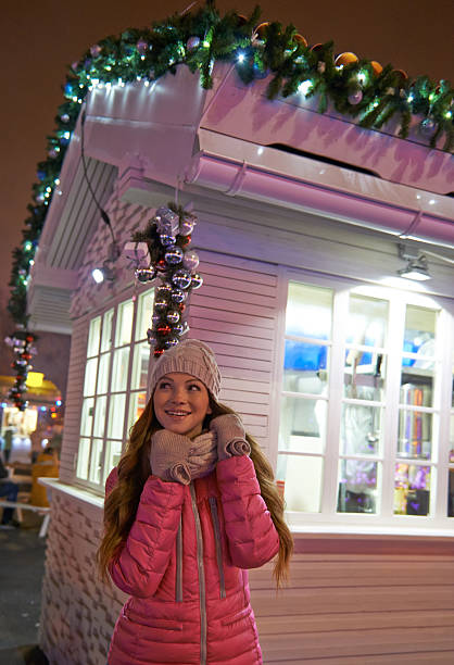 istock Young woman enjoying winter on ice rink 496233388