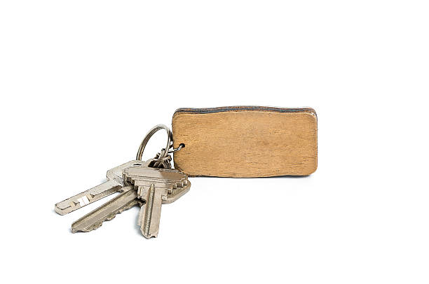 istock Keys with a blank tag from wood on white 496233540