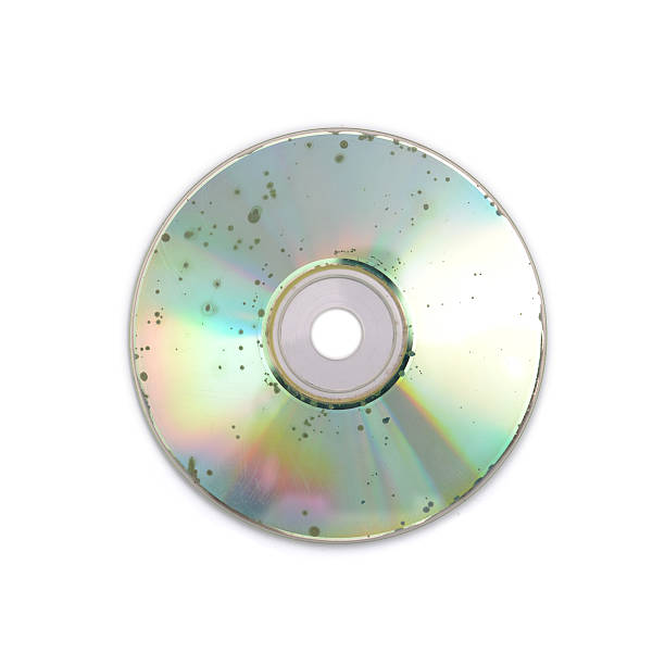 The CD shatters into pieces. Close up. Isolated on a white background.