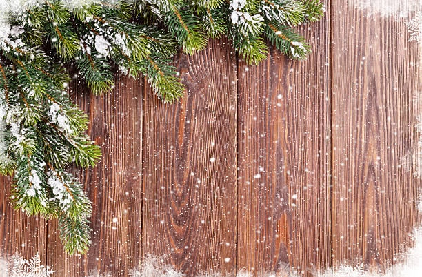 istock Christmas wooden background with snow fir tree 496235266