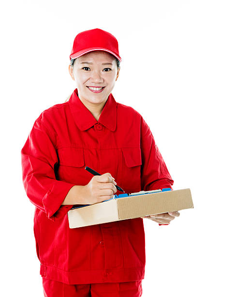 istock Delivery woman holding cardboard box 496236788