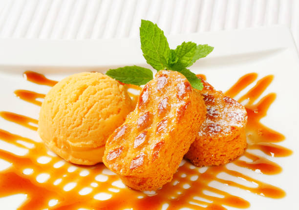 istock Small Dutch cakes with ice cream and drizzle sauce 496237877