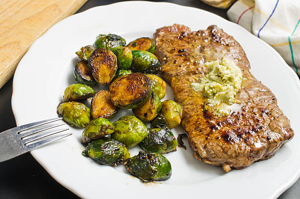 Beef steak with garlic butter and brussel sprouts