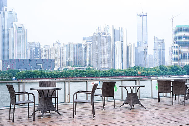 istock coffee bar by the river, opposite side is Guangzhou CBD 496238946