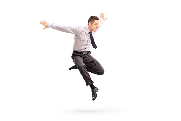 istock Young businessman jumping in the air 496239274