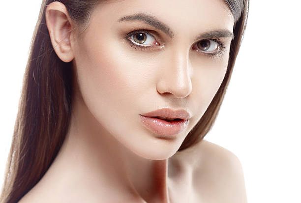 istock Beautiful woman face close up studio white sexy lips 496240352