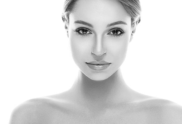 istock Beautiful woman face close up studio black and white 496240654