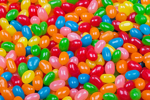 Background of delicious Jelly Bean candy Close up background of delicious Jelly Bean candy jellybean stock pictures, royalty-free photos & images