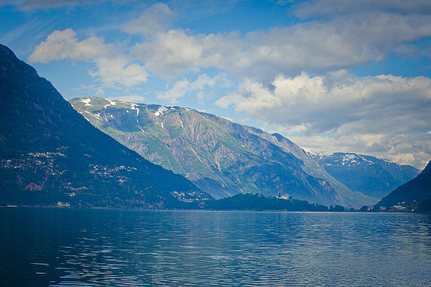 Beautiful Norwegian Summer Panorama Mountain Landscape near Trolltunga, Norway Beautiful summer vibrant view on the way to famous Norwegian tourist place - trolltunga, the trolls tongue with a lake and mountains, Norway, Odda. norway lysefjorden fjord norwegian currency stock pictures, royalty-free photos & images