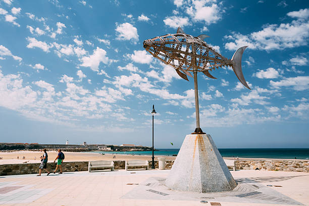 Tarifa, Spain - June 21, 2015: Weather vane in shape tuna on background sunny landscape. Designed by Pedro L.Barbera. The town is located on the Costa de la Luz (\