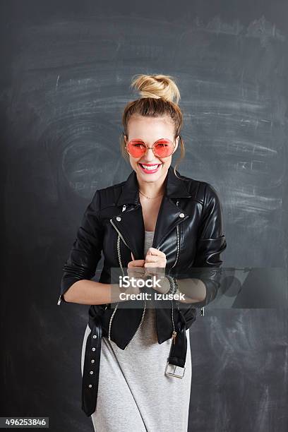 Happy Young Woman Against Blackboard Stock Photo - Download Image Now - Ecstatic, Excitement, Fashionable