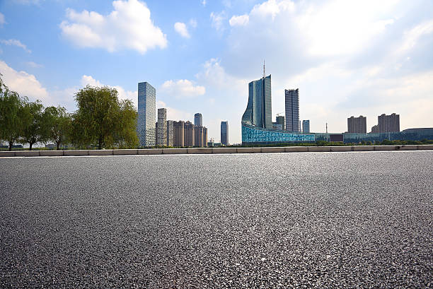 istock Empty road floor with City building background 496253944