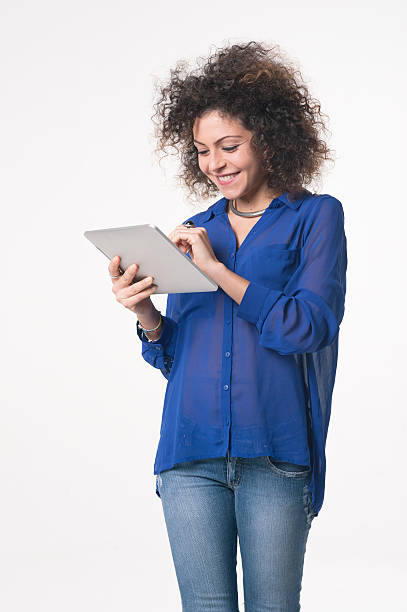 istock Young woman smiling with tablet 496254124