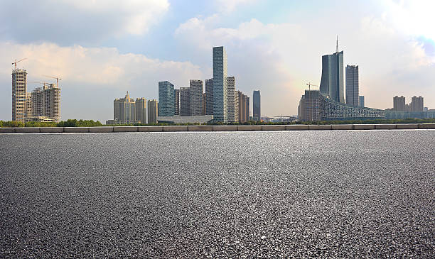 istock Empty road floor with City building background 496254178