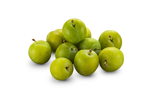 Organic Greengage Reine Claude Plums isolated on white background with shadow