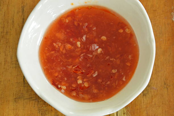 istock chicken chili sauce in cup on table 496254738