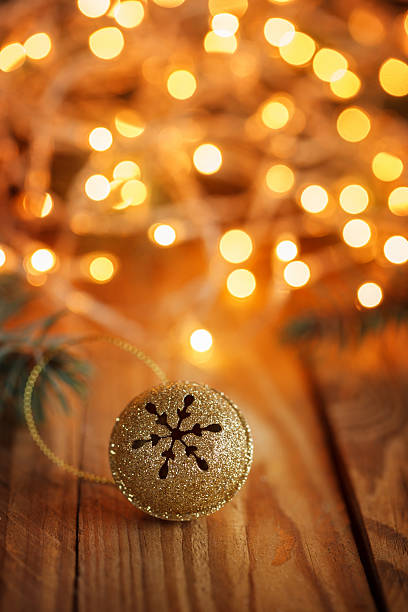 istock Gold Metal Jingle Bell with snowflake  with boke. 496254820