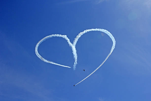 istock Vintage Aircraft Sky Writing Romantic Heart Shape 496256344