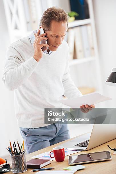 Discussing Some Business Issues Stock Photo - Download Image Now - 2015, 50-59 Years, Adult