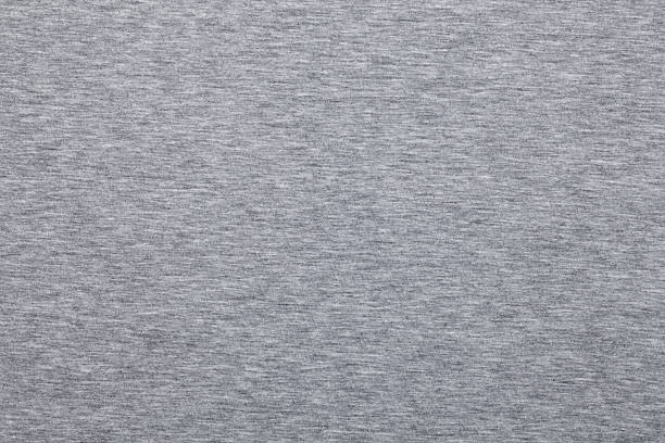 Melange jersey knit fabric pattern Real heather grey knitted fabric made of synthetic fibres textured background heather grey stock pictures, royalty-free photos & images