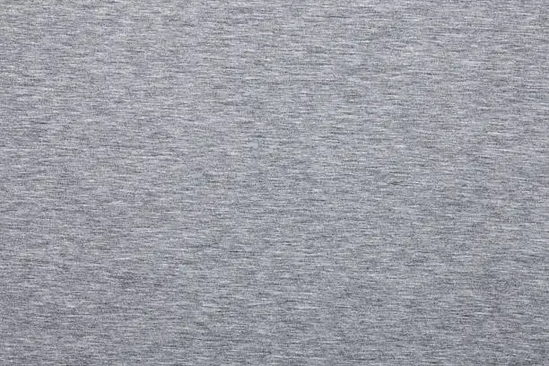 Real heather grey knitted fabric made of synthetic fibres textured background