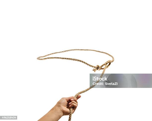 The Hand Throws A Lasso Stock Photo - Download Image Now - Lasso, Cut Out, Rope