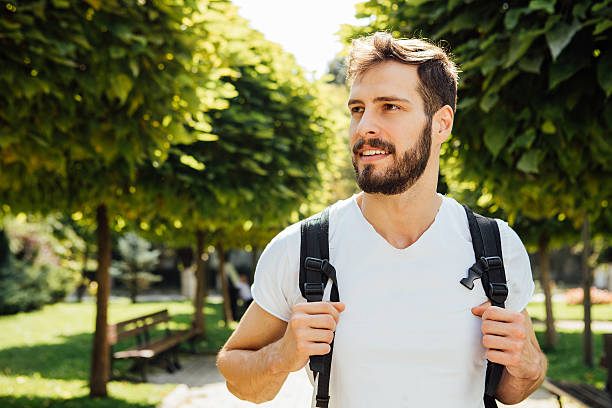Student with backpack outside stock photo