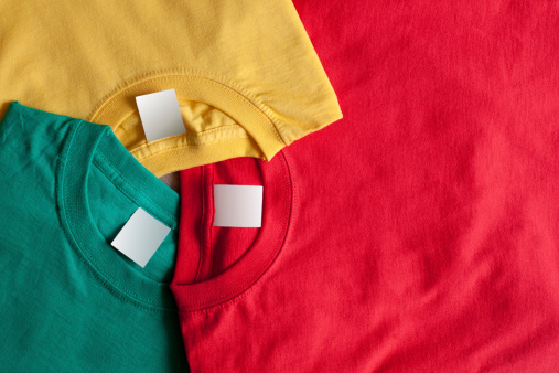Three colorful t-shirts. Clean label, bright background
