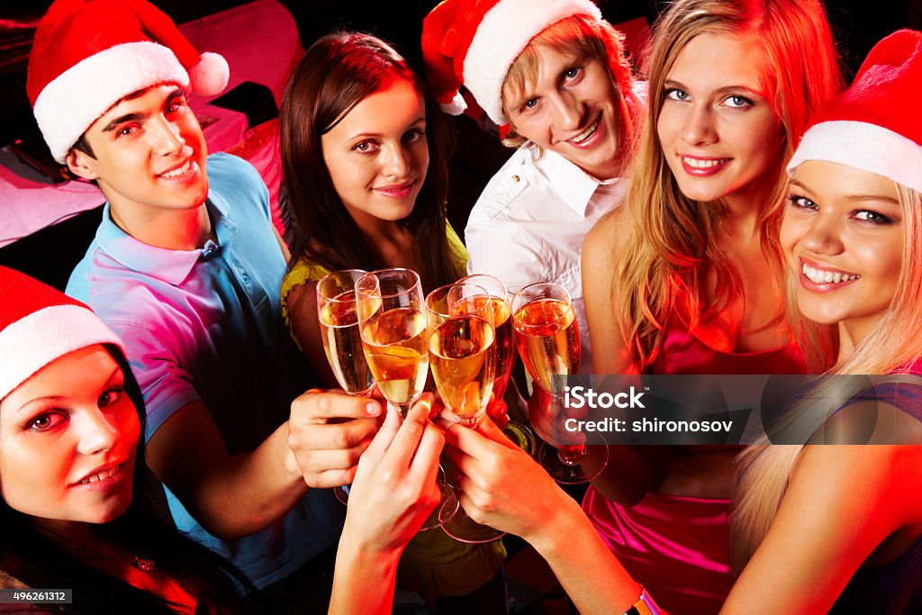 Celebration Above angle of young people enjoying themselves at Christmas party 2015 Stock Photo