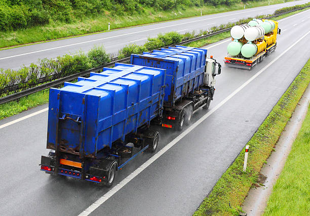 Toxic waste transport. Trucks with toxic waste on the highway. Industry and pollution concept. toxic waste stock pictures, royalty-free photos & images