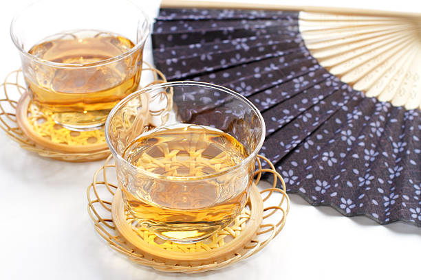 Japanese tea and fan showing the summer image stock photo
