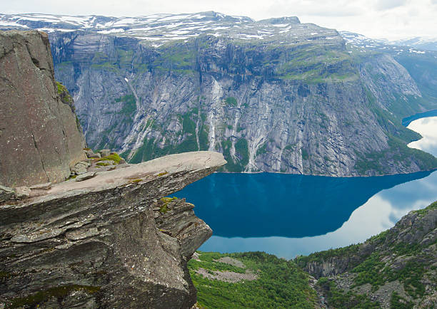 Famous norwegian rock hiking place - trolltunga, trolls tongue, Norway norway, nature, trolltunga, fjord, mountain, landscape, oslo, tongue, troll, hiking, norge, scandinavia, odda, summer, fjords, norwegian, lake, rock, iceland, reykjavik, ringedalsvatnet, hardanger, scandinavian, oslofjord, roldal, sognefjord, beautiful, blue, tourism, nordic, hardangervidda, prekestolen, preikestolen, kjerag, briksdal, Eidfjord, hordalann, Sognefjord, Hardangerfjord, Lysefjord, Geirangerfjord, Nordfjord, Oslofjord, Fjord Norway, Kjeragbolten, Pulpit Rock, Trollstigen, Voringsfossen, Vibrant, norway lysefjorden fjord norwegian currency stock pictures, royalty-free photos & images