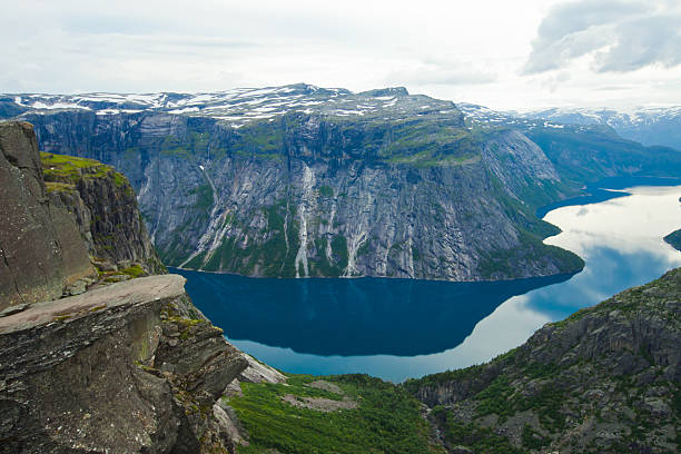 Famous norwegian rock hiking place - trolltunga, trolls tongue, Norway norway, nature, trolltunga, fjord, mountain, landscape, oslo, tongue, troll, hiking, norge, scandinavia, odda, summer, fjords, norwegian, lake, rock, iceland, reykjavik, ringedalsvatnet, hardanger, scandinavian, oslofjord, roldal, sognefjord, beautiful, blue, tourism, nordic, hardangervidda, prekestolen, preikestolen, kjerag, briksdal, Eidfjord, hordalann, Sognefjord, Hardangerfjord, Lysefjord, Geirangerfjord, Nordfjord, Oslofjord, Fjord Norway, Kjeragbolten, Pulpit Rock, Trollstigen, Voringsfossen, Vibrant, norway lysefjorden fjord norwegian currency stock pictures, royalty-free photos & images