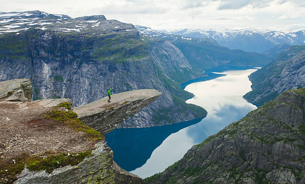 Famous norwegian rock hiking place - trolltunga, trolls tongue, Norway norway, nature, trolltunga, fjord, mountain, landscape, oslo, tongue, troll, hiking, norge, scandinavia, odda, summer, fjords, norwegian, lake, rock, iceland, reykjavik, ringedalsvatnet, hardanger, scandinavian, oslofjord, roldal, sognefjord, beautiful, blue, tourism, nordic, hardangervidda, prekestolen, preikestolen, kjerag, briksdal, Eidfjord, hordalann, Sognefjord, Hardangerfjord, Lysefjord, Geirangerfjord, Nordfjord, Oslofjord, Fjord Norway, Kjeragbolten, Pulpit Rock, Trollstigen, Voringsfossen, Vibrant, norway lysefjorden fjord norwegian currency stock pictures, royalty-free photos & images