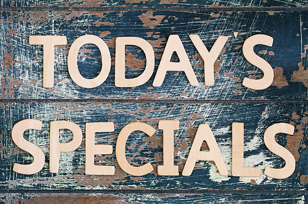 istock Today's specials written on rustic wooden surface 496264426