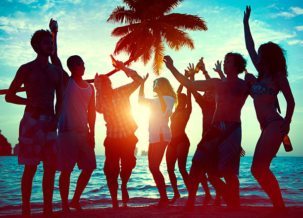 Silhouettes of Diverse Multiethnic People Partying Silhouettes of Diverse Multiethnic People Partying beach party stock pictures, royalty-free photos & images
